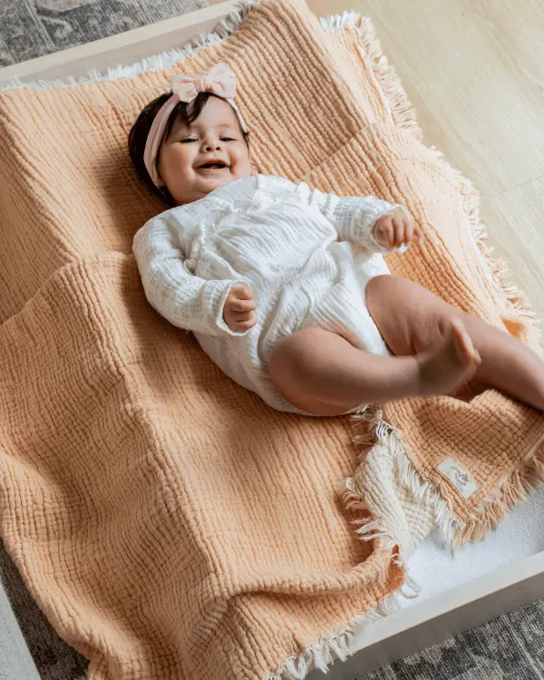 Alternative view of Little Fishies Gauze Receiving Blanket - Peach Fuzz | Sand Cloud